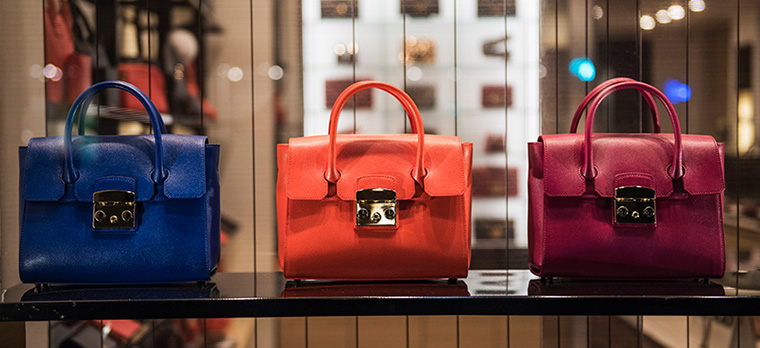 three handbags in a shop